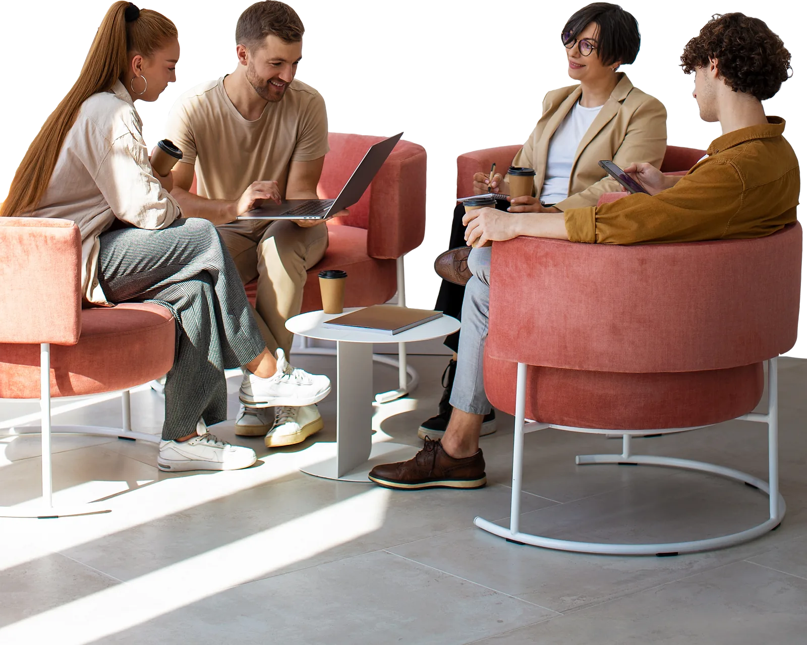 Team Collaboration | CAQA LLND A business team collaborates around a table, demonstrating employability skills in a casual office setting.