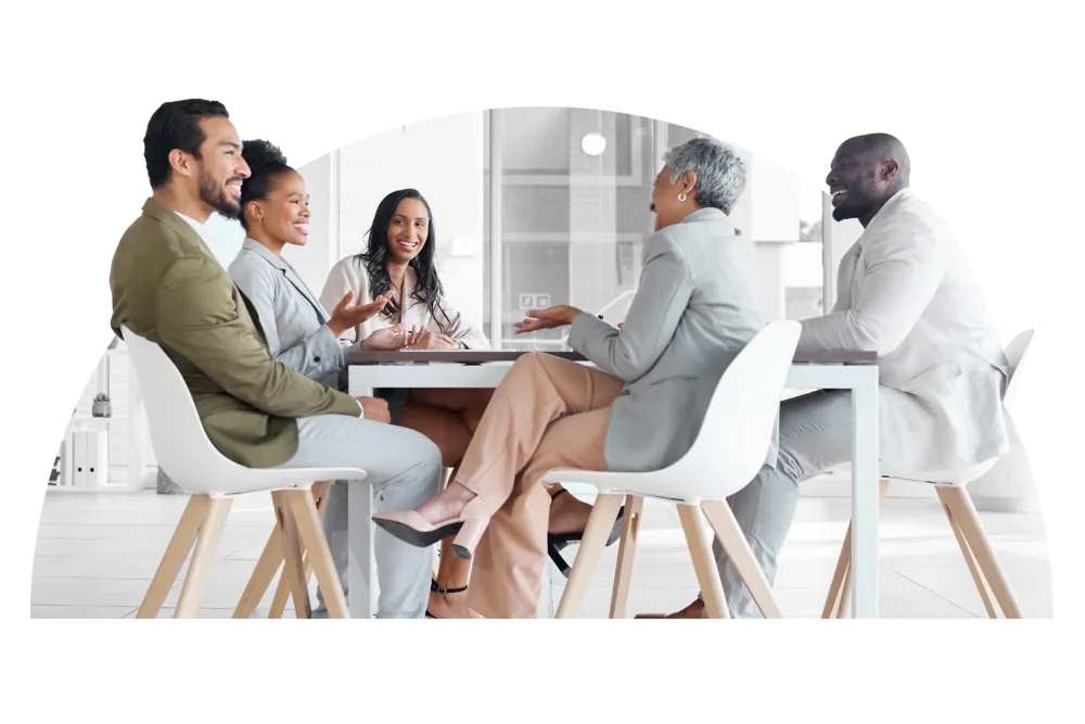 Diverse Team | CAQA LLND A diverse group of professionals collaborates around a conference table, demonstrating CAQA LLND’s commitment to.