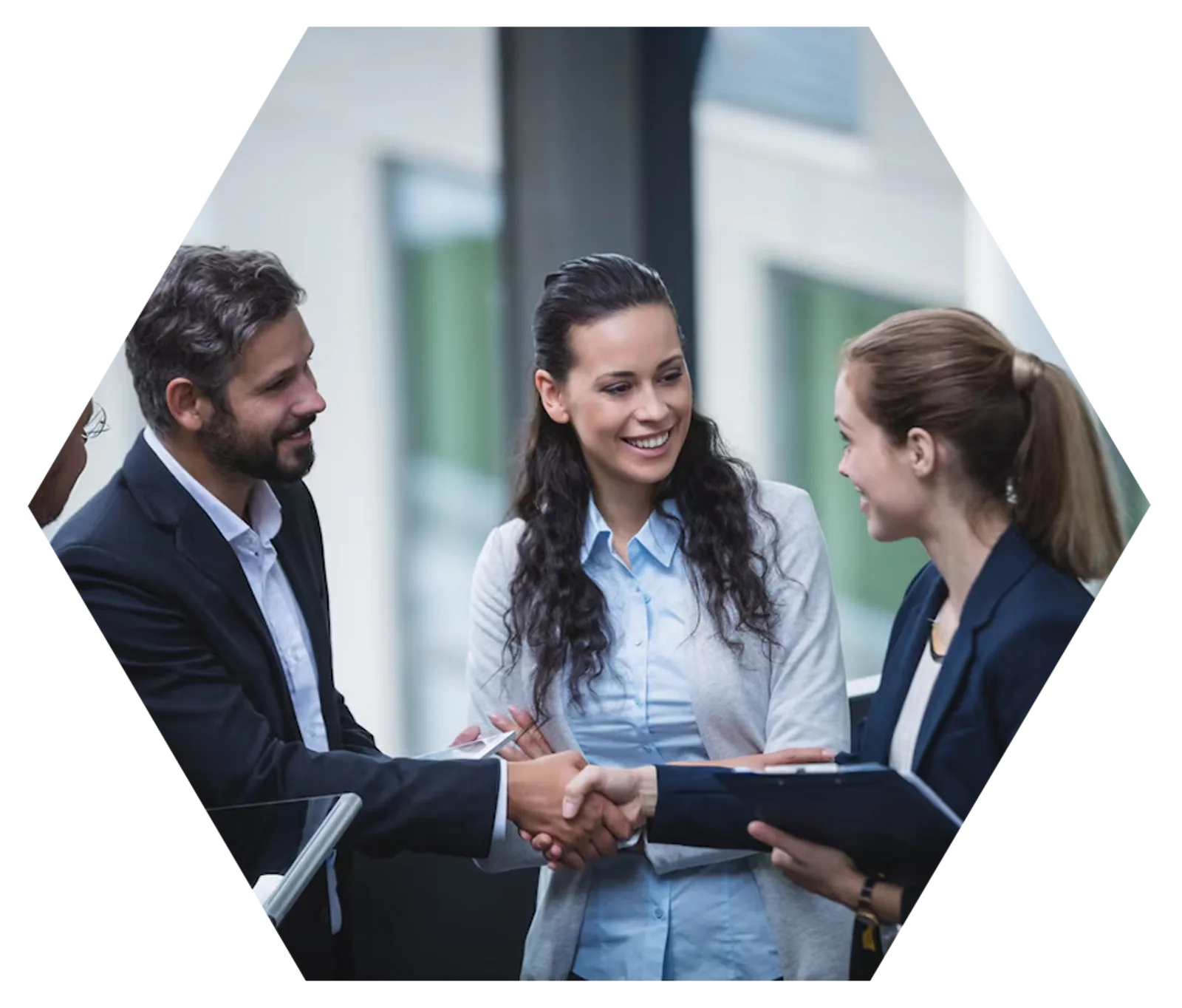 LLND Resource Development | CAQA LLND Three professionals shake hands during a meeting, demonstrating CAQA LLND's collaborative approach to resource development.