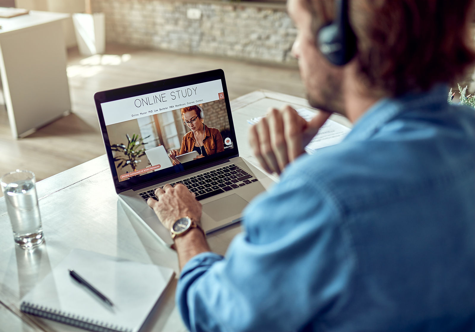 Online Learning | CAQA LLND A person studies online using a laptop and headphones for foundation skills training.