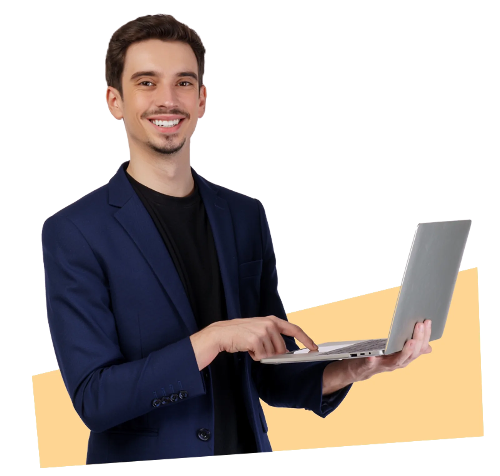 Smiling Trainer | CAQA LLND A smiling man in a suit types on a laptop during LLND training.