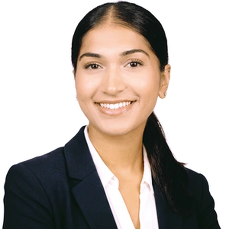 Avneet Bhinder | CAQA LLND A smiling Avneet Bhinder poses in business attire as part of the CAQA LLND team.