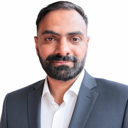 Rukman Sangha | CAQA LLND Rukman Sangha is a business professional with dark hair and a beard, part of the CAQA LLND team.
