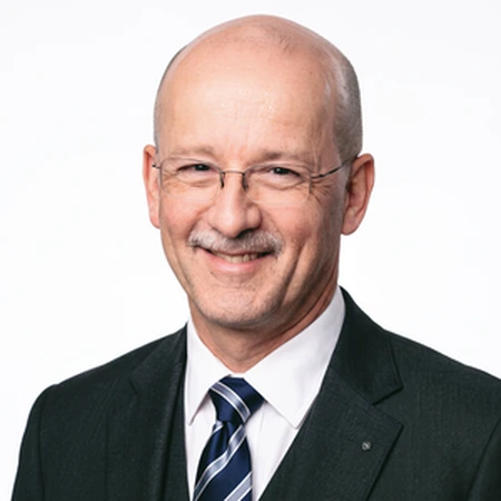 Steve Sutherland-Tomey | CAQA LLND A smiling Steve Sutherland-Tomey, a CAQA LLND consultant with glasses and mustache.