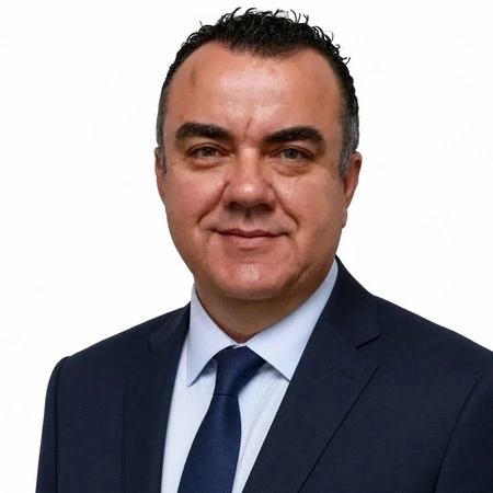 Stuart Newman | CAQA LLND A professional man in a suit smiles at the camera, representing our LLND team.