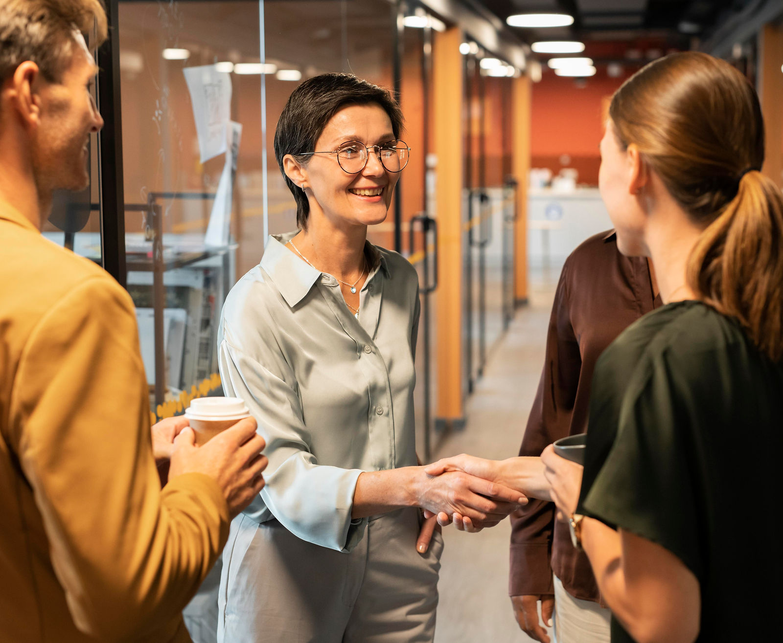 Handshake | CAQA LLND Two professionals shake hands during a business meeting, demonstrating CAQA LLND's commitment to partnership.